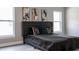 Bedroom with a black headboard and plush bedding, illuminated by natural light at 1738 Palm Rd, Ormond Beach, FL 32174