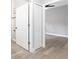 Hallway with doors and neutral gray wood-look flooring at 1738 Palm Rd, Ormond Beach, FL 32174