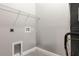 Laundry room with gray walls, white trim, and a wire shelf at 1738 Palm Rd, Ormond Beach, FL 32174