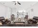 Spacious living room with a view into the kitchen, featuring modern decor and a comfortable seating area at 1738 Palm Rd, Ormond Beach, FL 32174