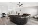 Open concept living room with hardwood floors, modern decor, and a seamless flow to the kitchen at 1738 Palm Rd, Ormond Beach, FL 32174