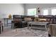 Comfortable living room with a black leather sectional and stylish decor at 1738 Palm Rd, Ormond Beach, FL 32174