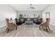 Bright and airy living room featuring a large sectional sofa and stylish decor at 1738 Palm Rd, Ormond Beach, FL 32174