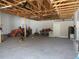 Unfinished garage with a ceiling and open rafters at 1870 Pepper Tree Ln, Deland, FL 32720