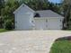 Spacious three car garage and stylish driveway with an ample room for multiple cars at 1870 Pepper Tree Ln, Deland, FL 32720