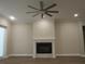 This living room features a fireplace, neutral walls, and hardwood floors for a cozy gathering space at 1870 Pepper Tree Ln, Deland, FL 32720