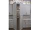 A view of a large walk-in pantry with custom shelving accessed from a closet-like door at 1870 Pepper Tree Ln, Deland, FL 32720