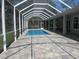 Relaxing in-ground pool inside screened enclosure, perfect for outdoor entertainment and enjoyment at 1870 Pepper Tree Ln, Deland, FL 32720