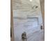 A modern shower with a built-in niche and marble-style tile work at 1870 Pepper Tree Ln, Deland, FL 32720