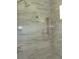 A luxurious shower featuring dual shower heads, marble-style tiling, and bright lighting at 1870 Pepper Tree Ln, Deland, FL 32720
