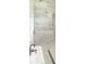 A luxurious shower with dual shower heads and marble-style tiling at 1870 Pepper Tree Ln, Deland, FL 32720