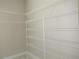A walk-in closet featuring wire shelving and neutral-toned walls at 1870 Pepper Tree Ln, Deland, FL 32720