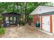 Backyard featuring a small shed, brick smoker, and a custom-built potting station for gardening enthusiasts at 20 Monroe Ave, Debary, FL 32713