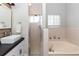 Elegant bathroom showcasing a sleek sink, glass shower, and a relaxing soaking tub at 20 Monroe Ave, Debary, FL 32713