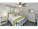 Bright bedroom with modern furniture, large window and ample closet space at 20 Monroe Ave, Debary, FL 32713