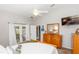 Cozy bedroom features a neutral color scheme, natural light, and backyard access at 20 Monroe Ave, Debary, FL 32713