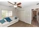 A cozy guest room with a white sofa and a glimpse of the hallway at 20 Monroe Ave, Debary, FL 32713