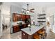 Kitchen boasting stainless appliances, granite countertops, breakfast bar, and modern lighting at 20 Monroe Ave, Debary, FL 32713