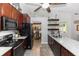 Kitchen view featuring stainless appliances, tile floors, granite counters, and open view to dining area at 20 Monroe Ave, Debary, FL 32713