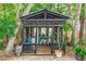 Charming outdoor gazebo featuring a wooden structure, offering a tranquil space surrounded by lush greenery at 20 Monroe Ave, Debary, FL 32713