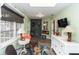 Well-lit sunroom with charming decor offering a versatile space for relaxation and activities at 20 Monroe Ave, Debary, FL 32713