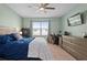 Well-lit bedroom with ample natural light, ceiling fan, and work space at 2000 White Pelican Ter, Sanford, FL 32771