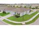 Aerial shot of a single-story home with a well-maintained lawn, attached garage, and white perimeter fence at 2000 White Pelican Ter, Sanford, FL 32771