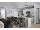 Modern kitchen featuring an island with bar seating, stainless appliances, and a pantry at 2000 White Pelican Ter, Sanford, FL 32771