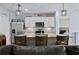 Bright kitchen features granite countertops, stainless steel appliances, and an island with barstool seating at 2000 White Pelican Ter, Sanford, FL 32771