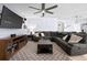 Spacious living room features a large sectional sofa, ceiling fan, and neutral decor at 2000 White Pelican Ter, Sanford, FL 32771