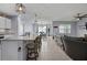 Open layout featuring a kitchen with island seating that flows into the living room at 2000 White Pelican Ter, Sanford, FL 32771