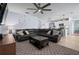Spacious living room features a ceiling fan and an opening to the kitchen creating an open-concept design at 2000 White Pelican Ter, Sanford, FL 32771