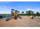 Community playground featuring slides, play structures, and a wood chip ground at 2000 White Pelican Ter, Sanford, FL 32771