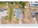 Aerial shot of the home featuring a private pool, gray roof, and spacious yard at 2055 Little Farms Ct, Deltona, FL 32738