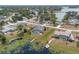 Stunning aerial view of homes, lake access, and a serene landscape at 2055 Little Farms Ct, Deltona, FL 32738