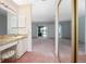 Bathroom vanity, storage and sink with large mirrors and ample lighting at 2055 Little Farms Ct, Deltona, FL 32738