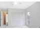 Bright bedroom featuring a ceiling fan, large closet, and natural light from a window at 2055 Little Farms Ct, Deltona, FL 32738