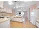 Bright kitchen with an opening to the living room and sliding glass doors to the exterior at 2055 Little Farms Ct, Deltona, FL 32738
