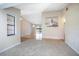 Spacious living room with neutral carpet and a large window for natural light at 2055 Little Farms Ct, Deltona, FL 32738