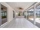 Spacious outdoor patio area with white tile flooring and a wood ceiling at 2055 Little Farms Ct, Deltona, FL 32738