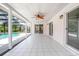 Covered patio with white tile, wood ceiling and view of the swimming pool at 2055 Little Farms Ct, Deltona, FL 32738