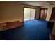 Bright bedroom features sliding glass doors to a private deck or patio at 2068 Pennsylvania Dr, Deland, FL 32724