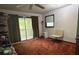 Comfortable bedroom with natural light and access to outdoor space at 2068 Pennsylvania Dr, Deland, FL 32724