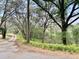 Gravel driveway leading to home site showcasing its privacy with its lush surroundings at 2068 Pennsylvania Dr, Deland, FL 32724