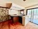 This entertainment area includes a unique wet bar and sliding glass doors to the outside at 2068 Pennsylvania Dr, Deland, FL 32724