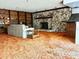 Cozy living room includes stone fireplace and built-in shelving at 2068 Pennsylvania Dr, Deland, FL 32724