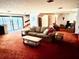 Bright living room features sliding glass doors to outdoor space and comfortable seating at 2068 Pennsylvania Dr, Deland, FL 32724