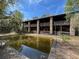 Exterior view of a building with a murky pool that needs cleaning in front at 2068 Pennsylvania Dr, Deland, FL 32724