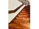 Carpeted staircase featuring a handrail at 2068 Pennsylvania Dr, Deland, FL 32724