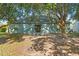 View of the rear of the home with a sliding glass door to the backyard at 2110 3Rd Ave, Deland, FL 32724